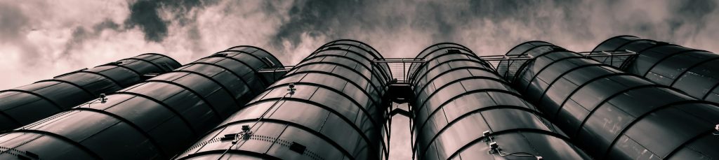 low-angle-view-of-industrial-silos-with-a-dramatic-cloudy-sky-in-the-background-emphasizing-modern-industry.-1385056-scaled-e1747681526712-1024x229 News